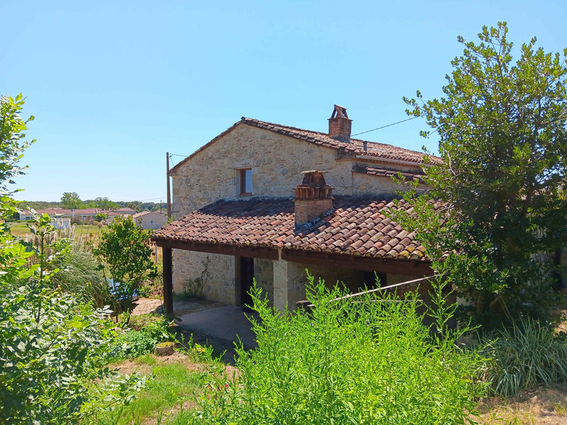 Stone house, garden, and garage.