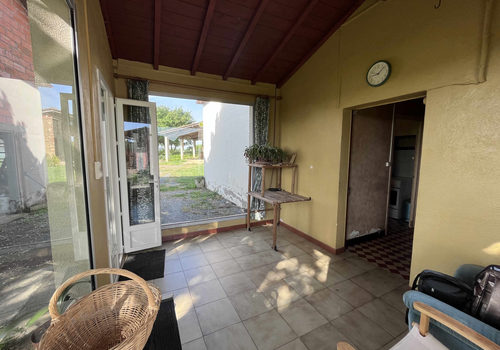 A property comprising a house and 5 outbuildings on a plot o