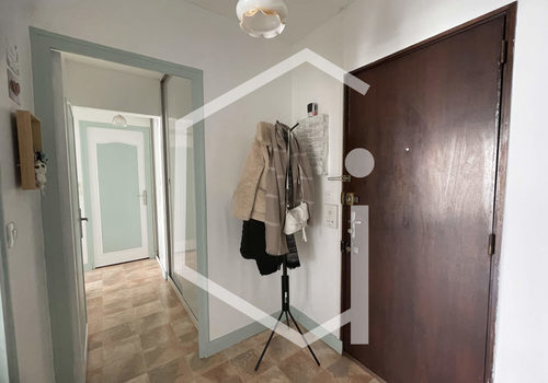 Appartement T2 avec balcon, cave et garage - Centre-ville de