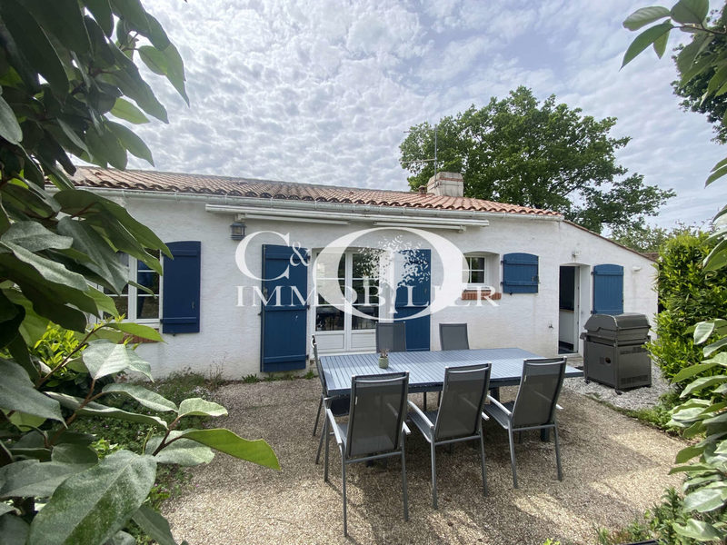 House in the village on a fenced garden